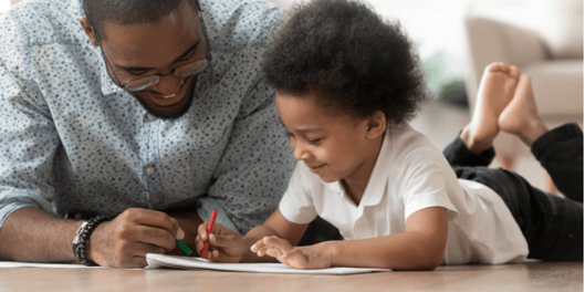 Dad and son drawing together