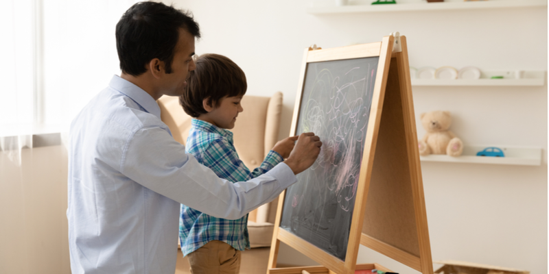 Dad and son with blackboard