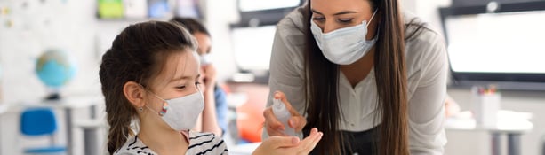 Teacher,And,Children,With,Face,Mask,Back,At,School,,Disinfecting