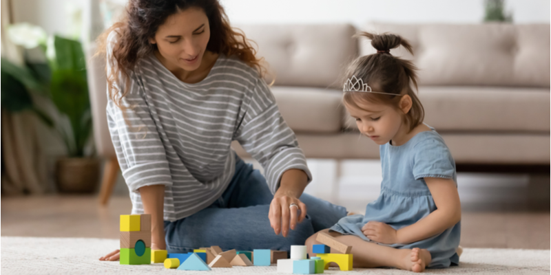 Mum and daughter building a tower