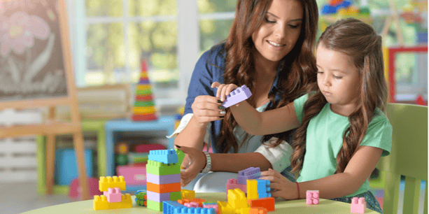Mum and daughter playing with coloured blocks