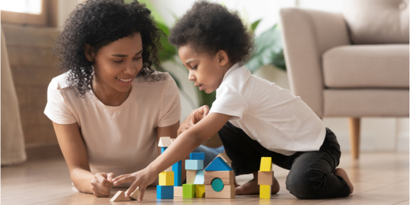 Mum and son building blocks together