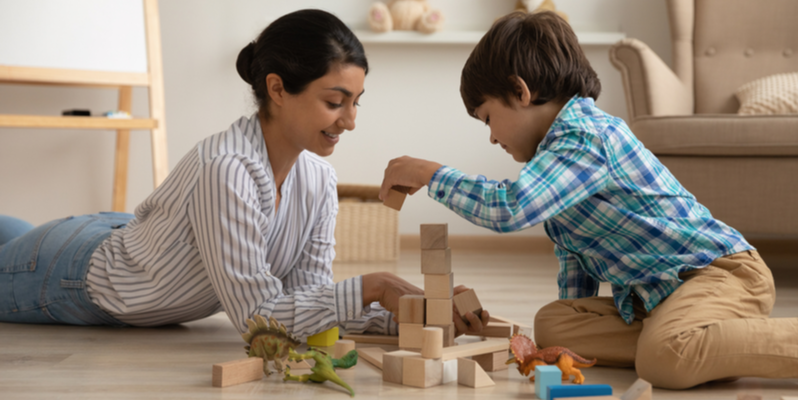 Mum and son playing with blocks 