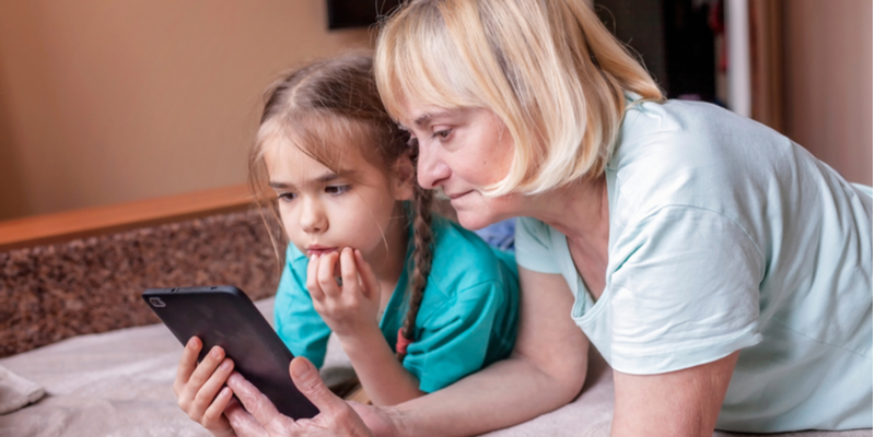 young girl and grandma engaging in online speech and langauge therapy sessions