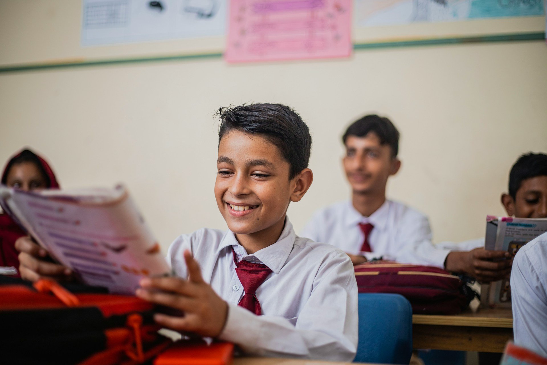british school child in uniform in lesson 