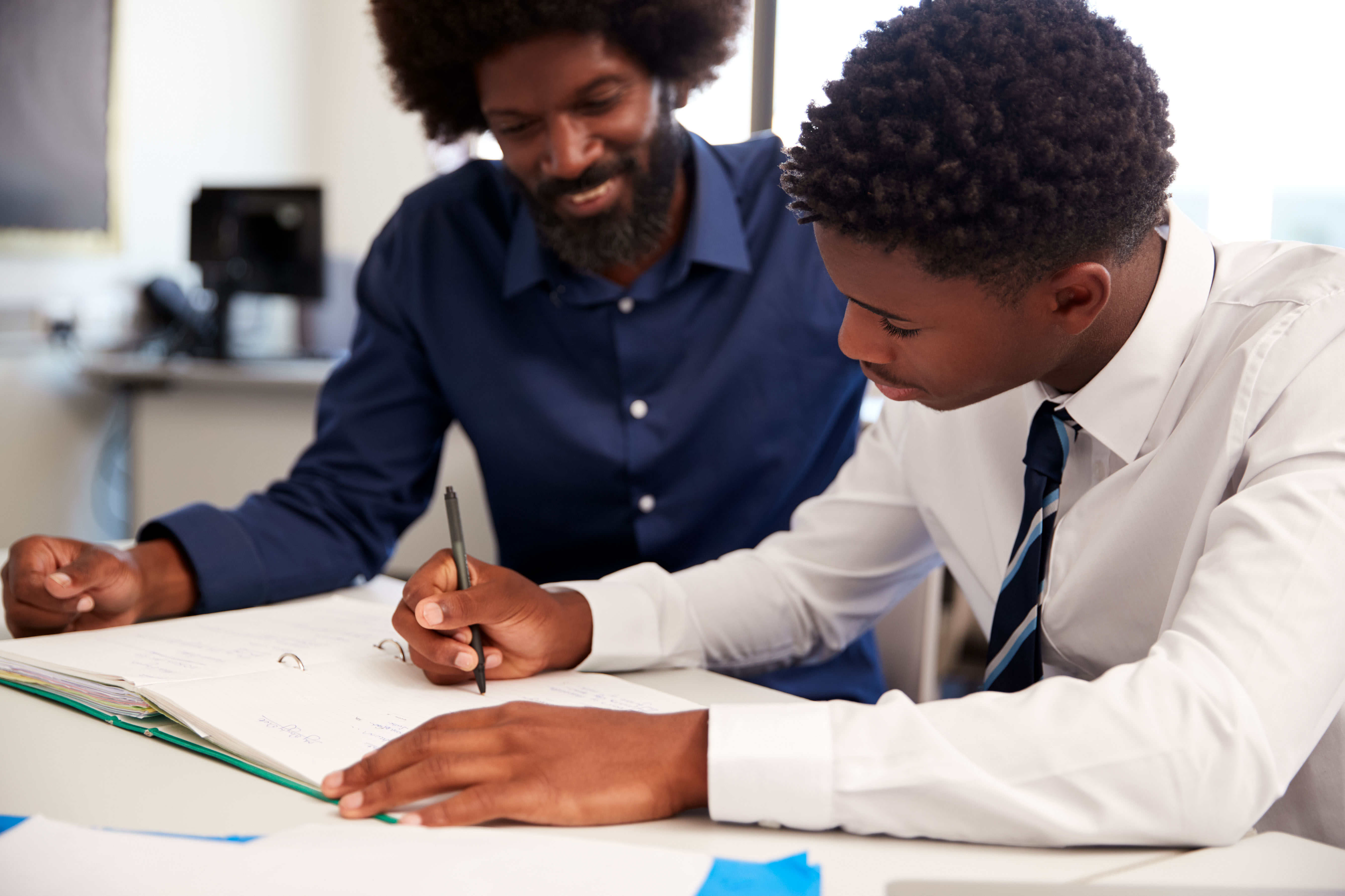 boy and teacher in class